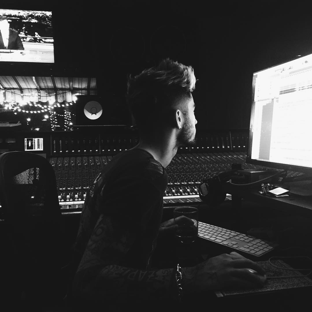 Zayn uses composing suite with monitor in peripheral vision.