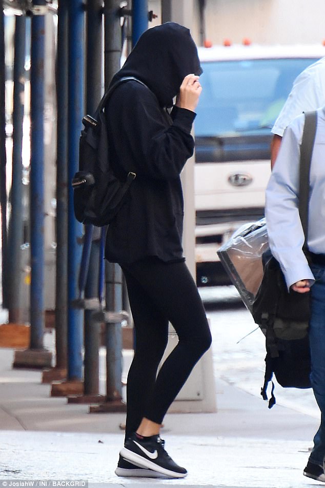 Taylor Swift in summer hoodie.